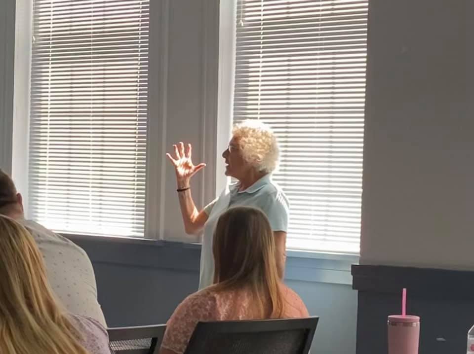 women speaking to a group
